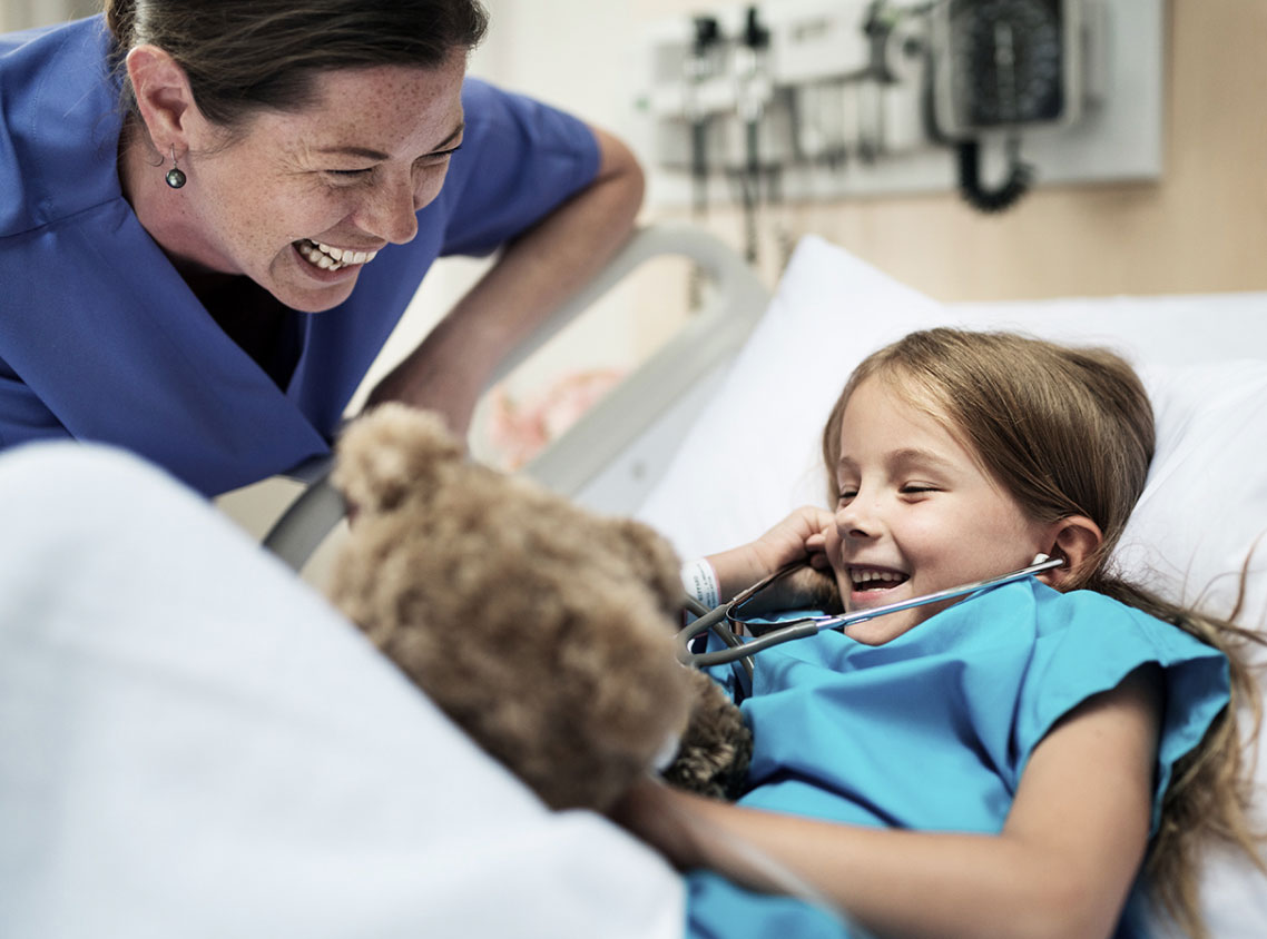 Nurse with child in hospital