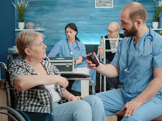 Male nurse helping patient