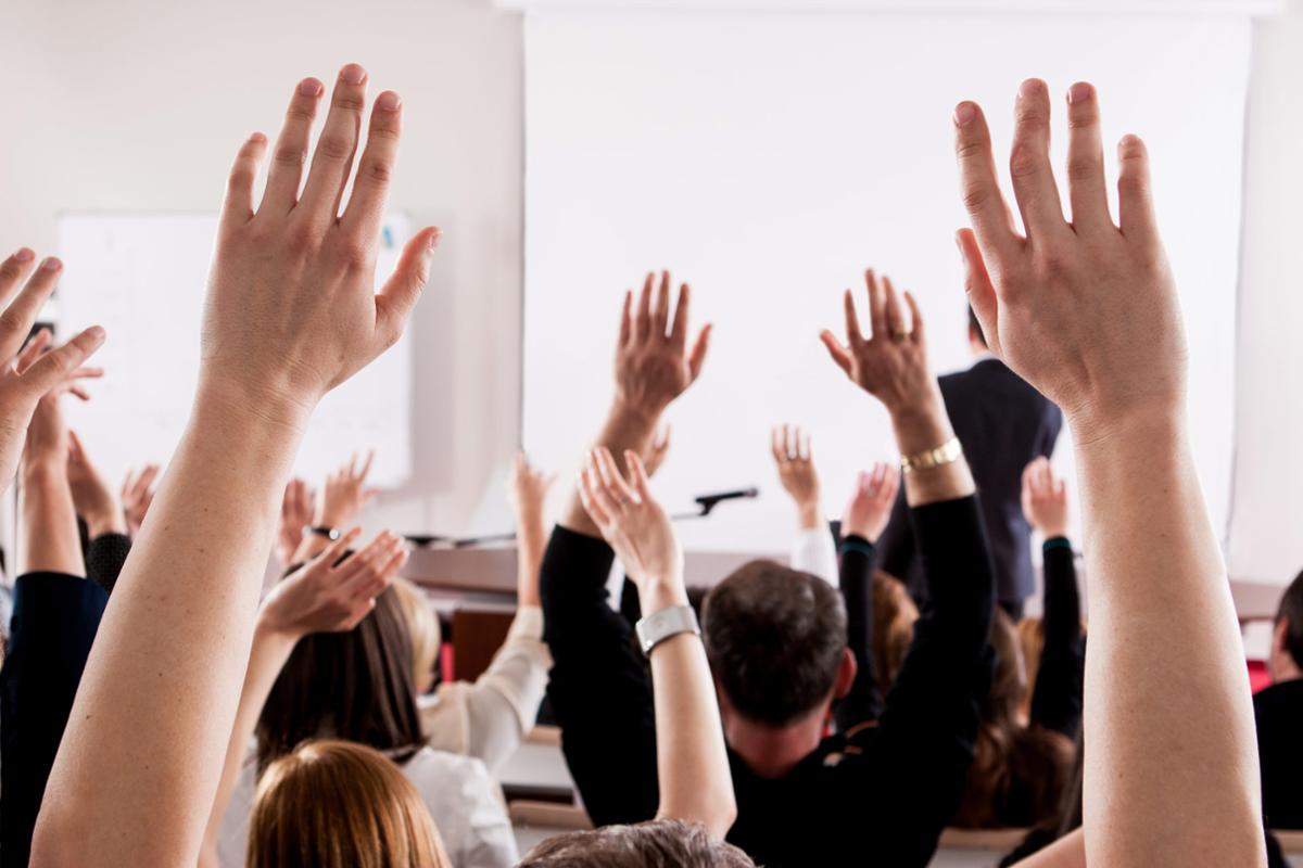 Learners raising their hands